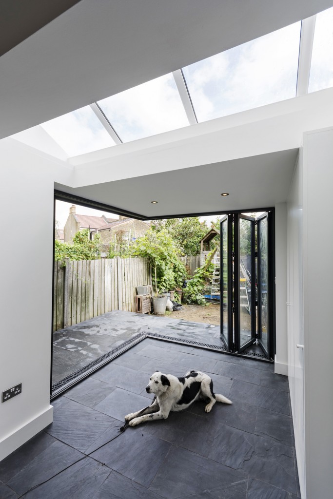 Cantilevered roof with bi-folding doors open